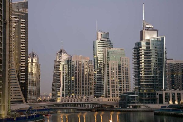 UAE, Dubai Tower lights reflect on marina water